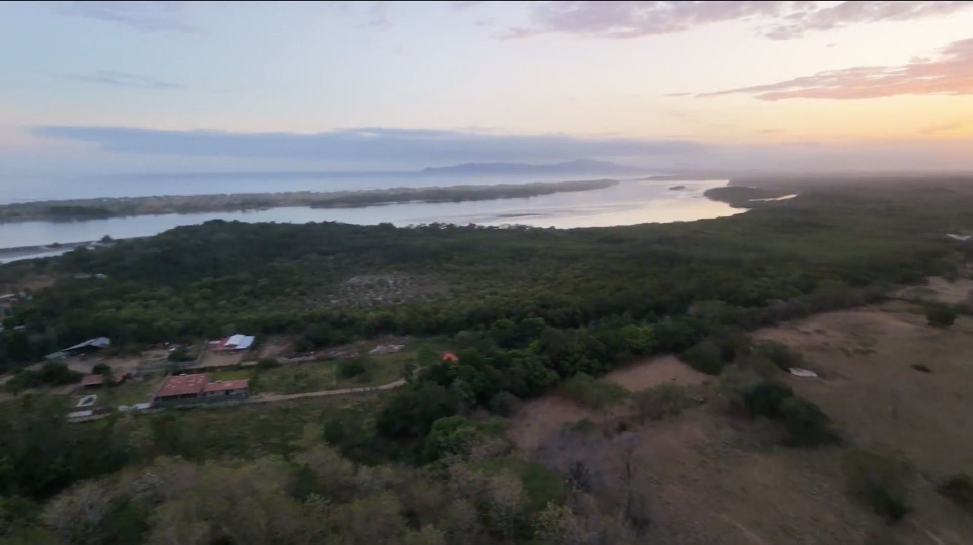 River, mangrove and Pacific Ocean at dusk near the land